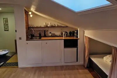 Image de Cosy big room with minikitchen in charming Miðvágur
