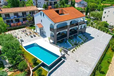 Image de Appartement de vacances Ii. dans les appartements Villa Calma avec piscine partagée