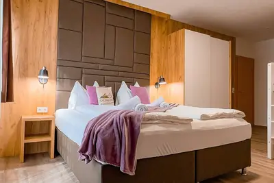 Image de Appartement 'Sylpaulerhof Aparthotel - Deluxe 8' avec vue sur la montagne, piscine partagée et Wi-Fi
