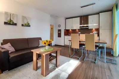 Image de Residenz Hohe Lith - Holiday apartment 205 with beach chair on the beach