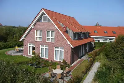 Image de Appartement 'Haus Admiral - Fewo Südwind' avec vue sur la mer, terrasse privée et Wi-Fi