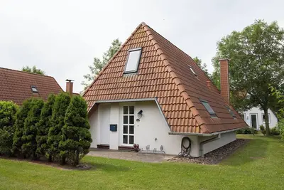 Image de Vacation home Westertill 8 with modern kitchen and wood-burning stove.