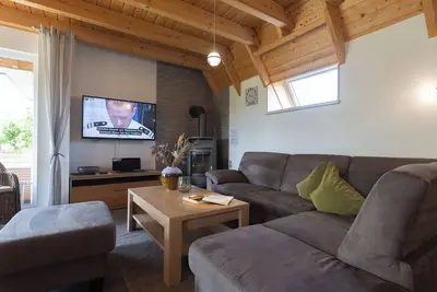 Image de Vacation home Mellumplate 50 with wood-burning stove and North Sea charm.