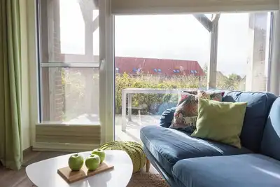 Image de Vacation apartment Wremer Bogen 9-1-1 directly on the mudflats and with terrace.