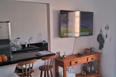 Image de Apartamento Confortável na Praia Grande com Varanda Gourmet Ar Cond. Tvs Smart