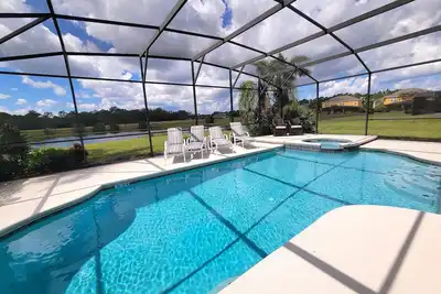 Image de Stunning villa with pool and spa overlooking a lake and conservation area.