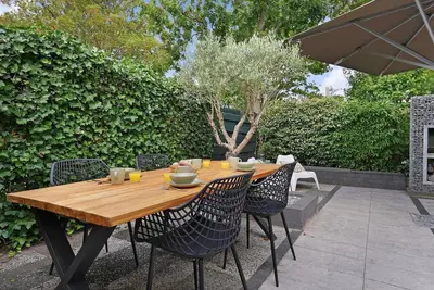 Image de A fresh, stylish, and child-friendly bungalow l (non-smoking) is located within walking distance (1. 5 km) of the Ouddorp beach.