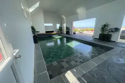 Image de Maison Avec Piscine Interieure Vue Sur Mer, mini golf, salle de sport