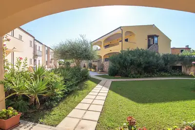 Image de Appartement 'I Mirti 1' avec terrasse privée, jardin partagé et climatisation