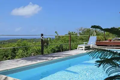 Image de Homerez - Villa moderne avec piscine à Sainte-Anne 154 m² vue mer