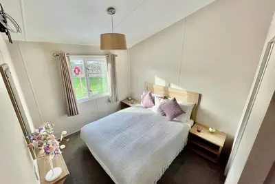 Image de Cozy home away from home 3 bed lodge with a hot tub @ 101 Windsor Pendine Sands.