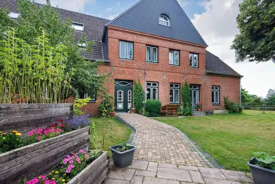 Image de Appartement 'Reit- Und Ferienhof Alte Dorfschule' avec piscine partagée, terrasse privée et Wi-Fi