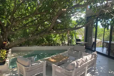 Exclusive and beautiful new house immersed in nature, 100 m from the beach.