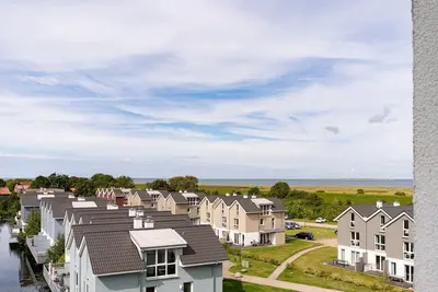 Image de Vacation apartment with a view of the sea and meadows, sauna & electric fireplace for relax