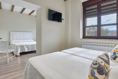 Image de Chambre 'Habitacion Familiar' avec piscine partagée, terrasse partagée et Wi-Fi