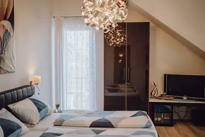 Image de Appartement 'Familienzimmer Nr 1 - Mit 2 Kindern' avec terrasse partagée et Wi-Fi