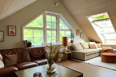 Charming attic apartment by the sea - with fireplace and cozy living room