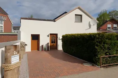 Image de Appartement 'Ferienhaus Am Mühlenweg Brunsbüttel' avec terrasse privée, jardin privé et Wi-Fi
