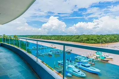 Serene condo with ocean views, modern amenities & pool access