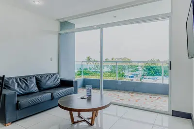Coastal condo with stunning sea views, rain shower & private balcony escape