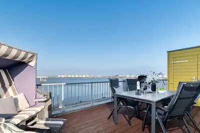 Image de Hus Twustern - directly on the water, whirlpool, sauna, fireplace, balcony, parking space