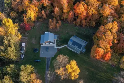 Spacious, modern 4-Br house in serene wooded setting just minutes from downtown