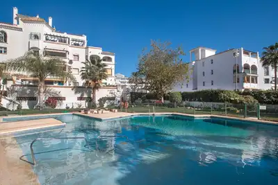 Image de Appartement 'Benalmar Bajo C' avec piscine partagée, Wi-Fi et climatisation