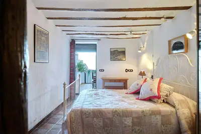 Image de Chambre \"Tranco\" avec vue sur la montagne et terrasse privée