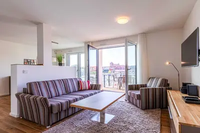 Image de 4-star apartment Sieglinde in the harbor residence.