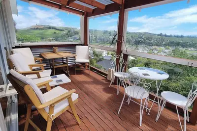 Image de Views, art, comfort, charming house in Nelson. Deck, beautiful garden and lounge