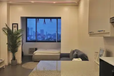 Image de Clean & Cozy 1-bedroom condo in Kamuning, Quezon City with fast WiFi, Ac,