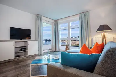 Image de Meereskieker - 1st row on the water, terrace, shower, Tv, underground parking space