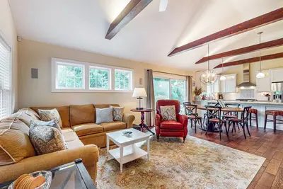 Charming home with a jacuzzi, fire pit, gas grill, large yard, and porch!