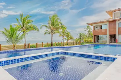 Image de It91 Wonderful apartment right on the sand - Itacimirim
