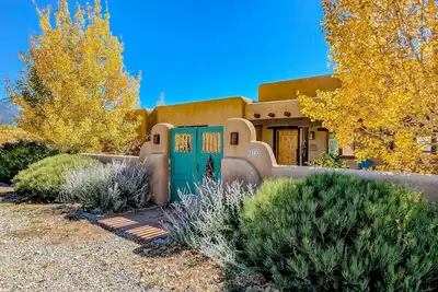 Gorgeous adobe home with spacious patio, kivas, hot tub & incredible views