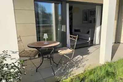 Image de Sublime appart avec jardin | 5 mn à pied des halles et des plages