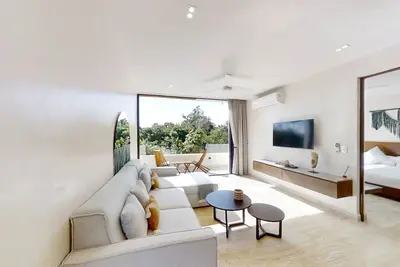 Stylish retreat with spacious balcony, lush gardens and gym