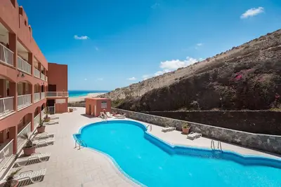 Vacances 'Home Sweet Home with Ocean View' avec vue sur la mer, piscine partagée et Wi-Fi