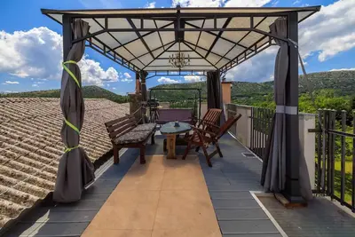 Image de Appartement de vacances avec climatisation et terrasse avec mobilier de jardin
