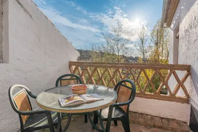 Image de Appartement 'El Granero' avec vue sur la montagne, piscine partagée et Wi-Fi