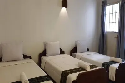 Image de Smiley's Guesthouse : Triple Room- Airconditioning\n