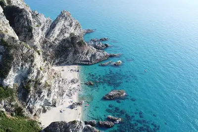 Image de Villino Due, with steps to the beach in Capo Vaticano