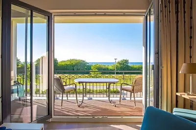 Image de Appartement 'Waterkant 180 Grad' avec vue sur la mer, terrasse privée et Wi-Fi