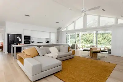 Image de Resort style living with pool, tennis court and beach
