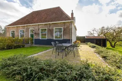 Image de Ferme Ă Zeeland avec vue sur moulin