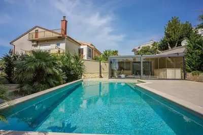 Image de Unique apartment only 500 meters to the beach with sauna, gym, pool, WiFi