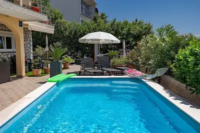 Image de Fascinant appartement à seulement 200 mètres de la plage avec vue sur la mer, piscine, barbecue, espace salon
