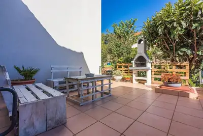 Image de Appartement lumineux avec vue sur la mer, machine à expresso, zone barbecue, machine à laver