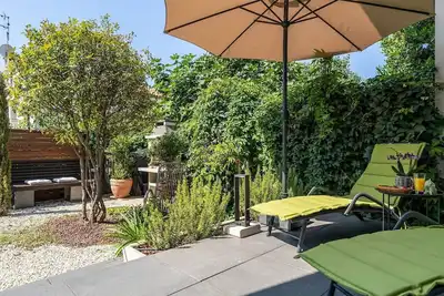 Image de Maison de vacances exquise avec jardin privé, chaises longues, chaise d'enfant, machine à laver - à seulement 700 mètres de la plage