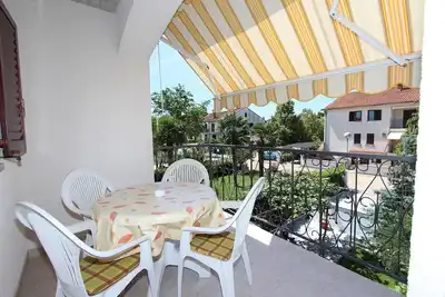 Image de Appartement confortable avec balcon privé, parking privé, lit bébé, climatisation